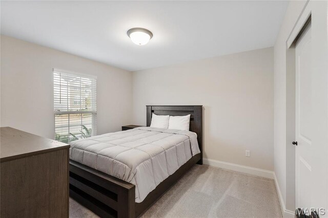 7405 Shadow Point Dr, Saint Louis, MO 63129 - bedroom featuring light colored carpet and baseboards