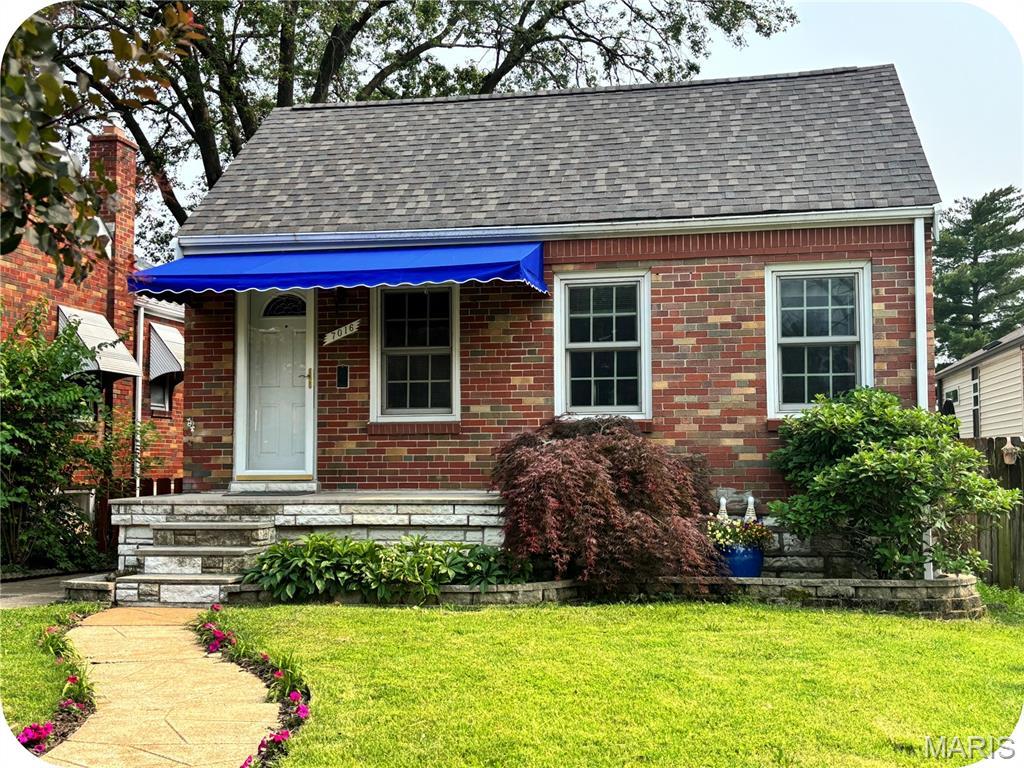 7016 Plainview Ave, Saint Louis, MO 63109 - view of front of property featuring roof with shingles, a front lawn, and brick siding