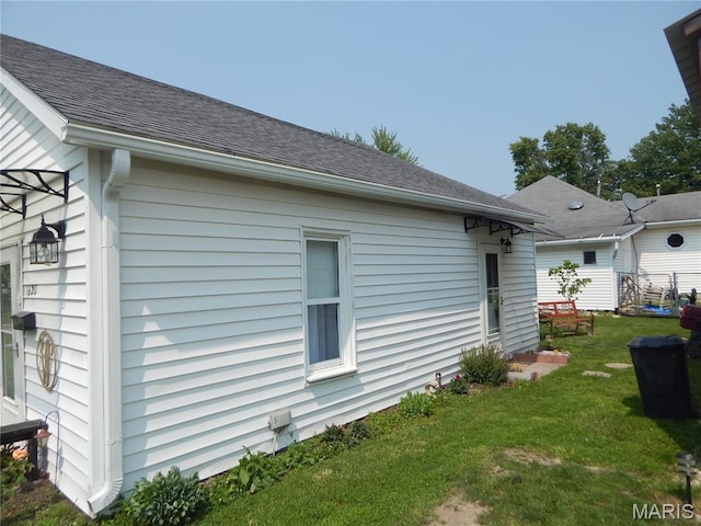 1620 W Centennial Ave, Bowling Green, MO 63334 - view of home's exterior with a lawn and a shingled roof