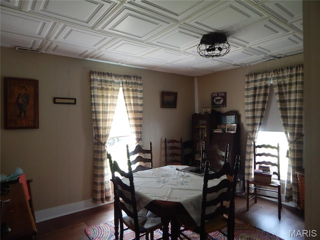 1620 W Centennial Ave, Bowling Green, MO 63334 - dining room featuring plenty of natural light, an ornate ceiling, wood finished floors, and baseboards