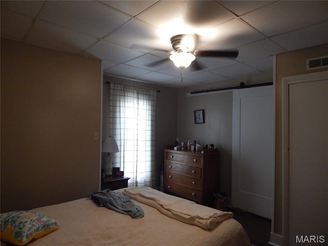 1620 W Centennial Ave, Bowling Green, MO 63334 - bedroom with a barn door, a paneled ceiling, and a ceiling fan