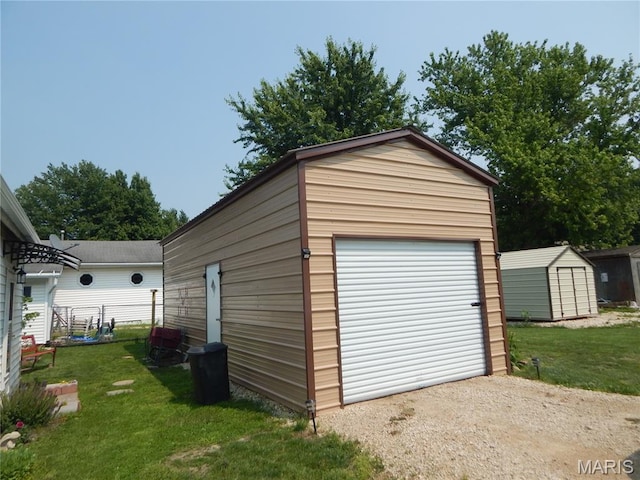 1620 W Centennial Ave, Bowling Green, MO 63334 - detached garage featuring driveway and a shed