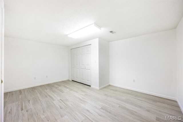 608 Andra Dr, Maryville, IL 62062 - bonus room with light wood-style flooring and baseboards