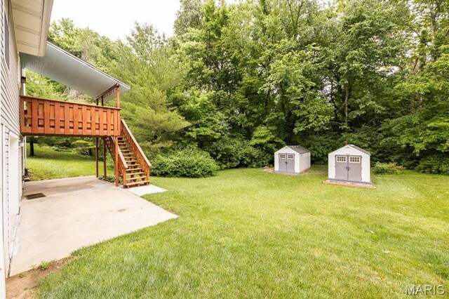 608 Andra Dr, Maryville, IL 62062 - view of green lawn featuring a patio, stairs, and a deck