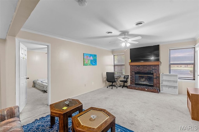 2339 Kratky Rd Unit A, Saint Louis, MO 63114 - carpeted living area with a brick fireplace, ornamental molding, and a ceiling fan