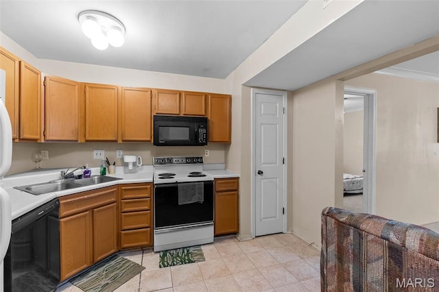 2339 Kratky Rd Unit A, Saint Louis, MO 63114 - kitchen featuring black appliances, a sink, light countertops, and light tile patterned floors