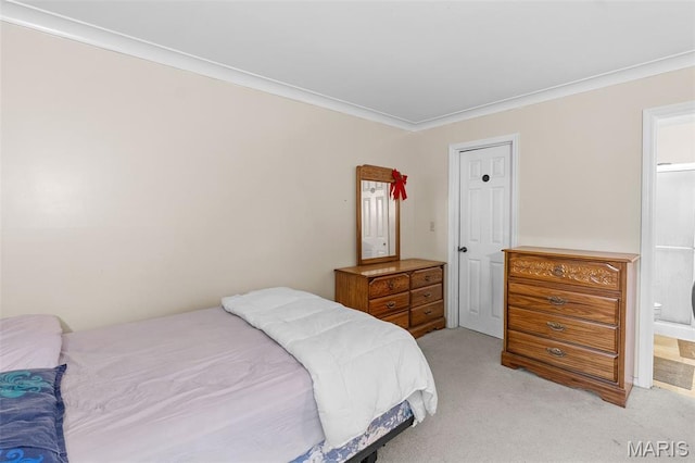 2339 Kratky Rd Unit A, Saint Louis, MO 63114 - bedroom featuring light carpet, ornamental molding, and ensuite bath