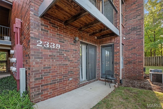 2339 Kratky Rd Unit A, Saint Louis, MO 63114 - entrance to property with cooling unit and brick siding