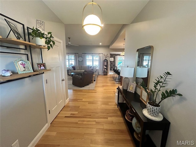 615 Jonathan Rd, Hannibal, MO 63401 - hall featuring light wood-style flooring, baseboards, and vaulted ceiling