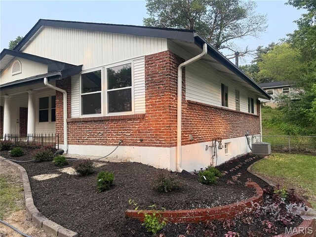 2542 Dukeland Dr, Ferguson Township, MO 63136 - view of property exterior with central AC and brick siding
