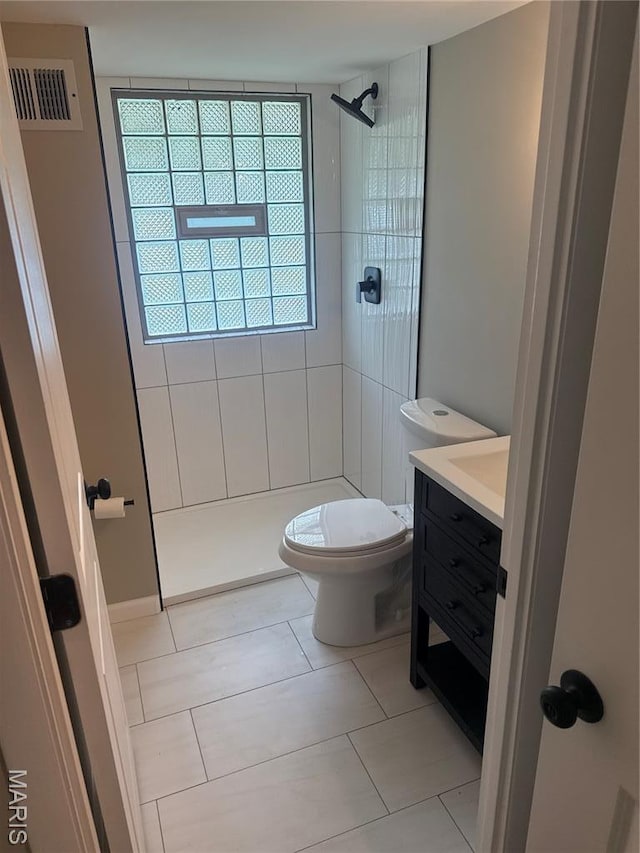2542 Dukeland Dr, Ferguson Township, MO 63136 - bathroom with healthy amount of natural light, a shower stall, toilet, and vanity