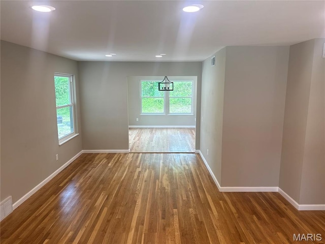 2542 Dukeland Dr, Ferguson Township, MO 63136 - unfurnished room featuring wood finished floors, plenty of natural light, baseboards, and recessed lighting