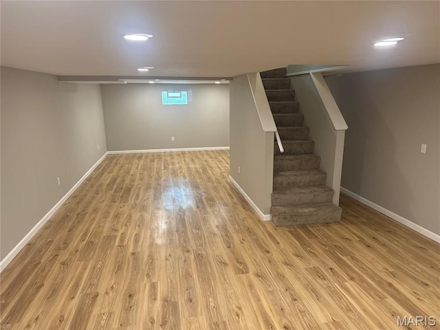 2542 Dukeland Dr, Ferguson Township, MO 63136 - below grade area with wood finished floors, stairs, baseboards, and recessed lighting