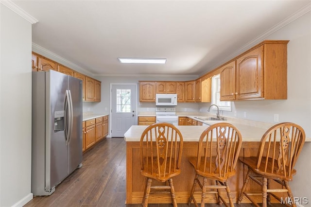 3936 State Highway 142, Doniphan, MO 63935 - kitchen featuring white appliances, a sink, a peninsula, light countertops, and ornamental molding