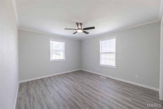 3936 State Highway 142, Doniphan, MO 63935 - empty room featuring plenty of natural light, a ceiling fan, wood finished floors, and ornamental molding