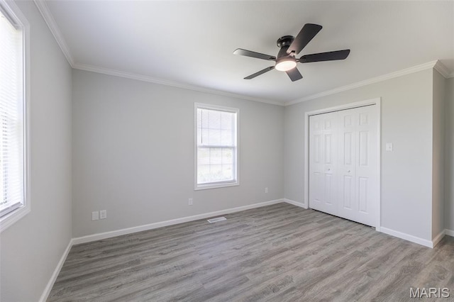 3936 State Highway 142, Doniphan, MO 63935 - unfurnished bedroom featuring wood finished floors, ornamental molding, baseboards, a closet, and a ceiling fan