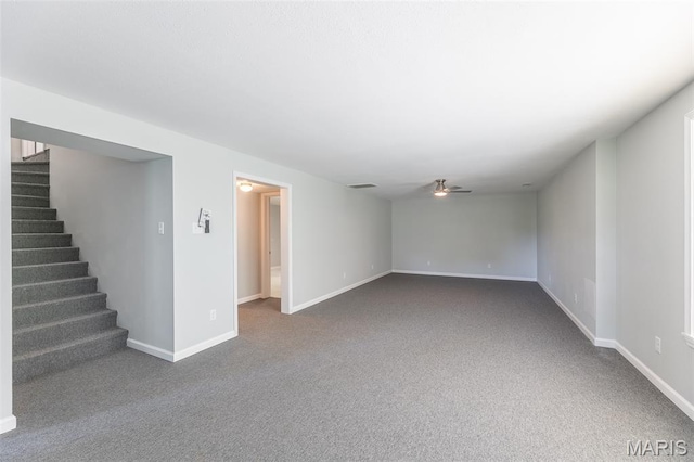 3936 State Highway 142, Doniphan, MO 63935 - unfurnished living room with ceiling fan, stairs, dark colored carpet, and baseboards