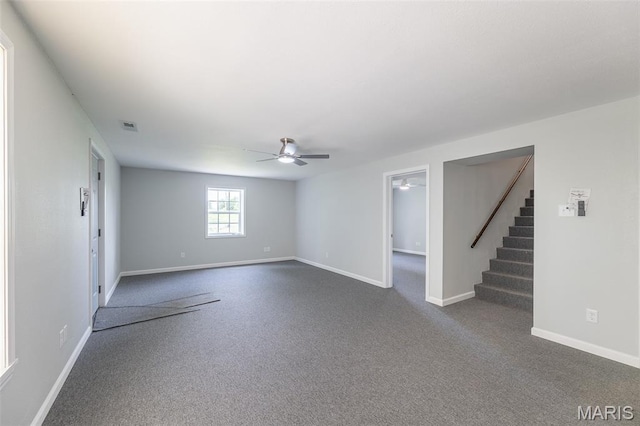 3936 State Highway 142, Doniphan, MO 63935 - empty room featuring ceiling fan, stairs, baseboards, and dark colored carpet