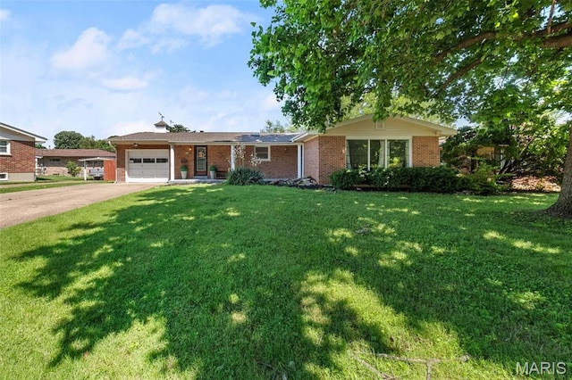 417 Concordia Ln, Saint Charles, MO 63301 - single story home with an attached garage, brick siding, concrete driveway, and a front lawn
