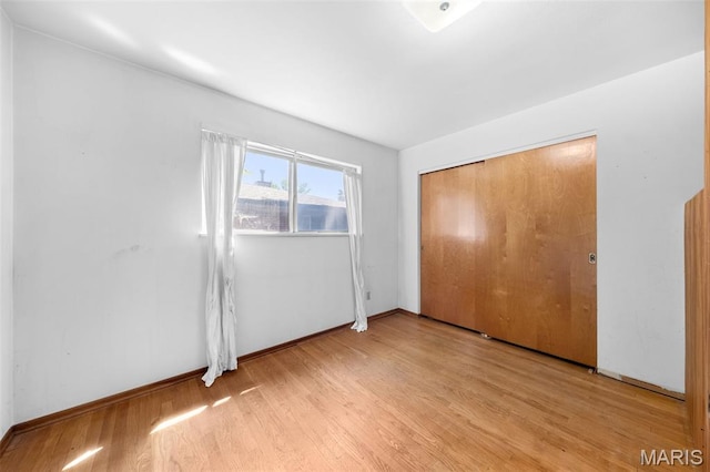 417 Concordia Ln, Saint Charles, MO 63301 - unfurnished bedroom with light wood finished floors and a closet