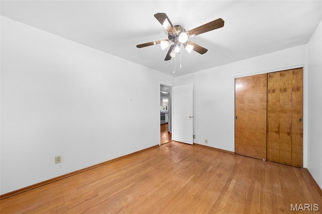 417 Concordia Ln, Saint Charles, MO 63301 - unfurnished bedroom featuring wood finished floors and a ceiling fan