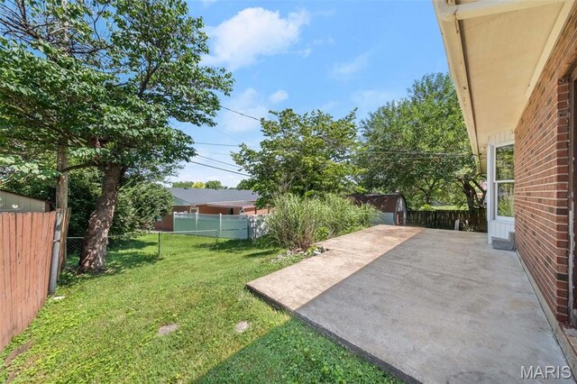 417 Concordia Ln, Saint Charles, MO 63301 - fenced backyard featuring a patio area
