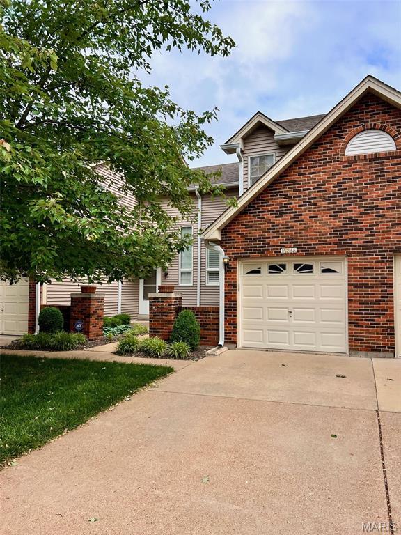 16266 Lea Oak Ct, Chesterfield, MO 63017 - view of front of property featuring concrete driveway, brick siding, and an attached garage