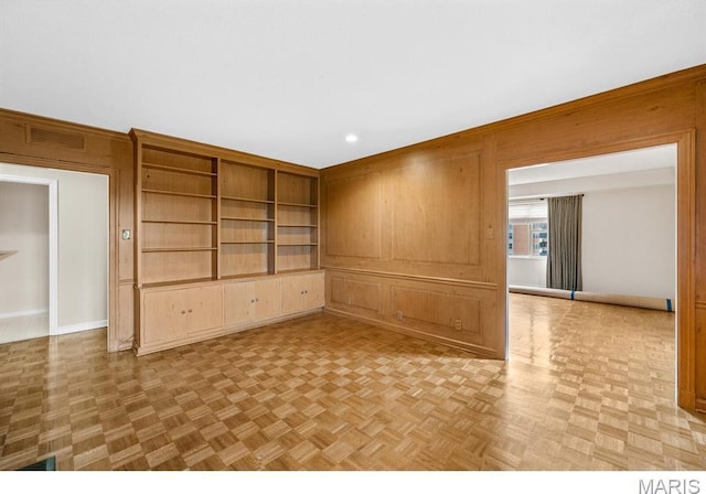 710 S Hanley Rd Unit 10A, Clayton, MO 63105 - unfurnished room featuring wood walls and recessed lighting
