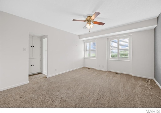 710 S Hanley Rd Unit 10A, Clayton, MO 63105 - empty room with a ceiling fan and carpet