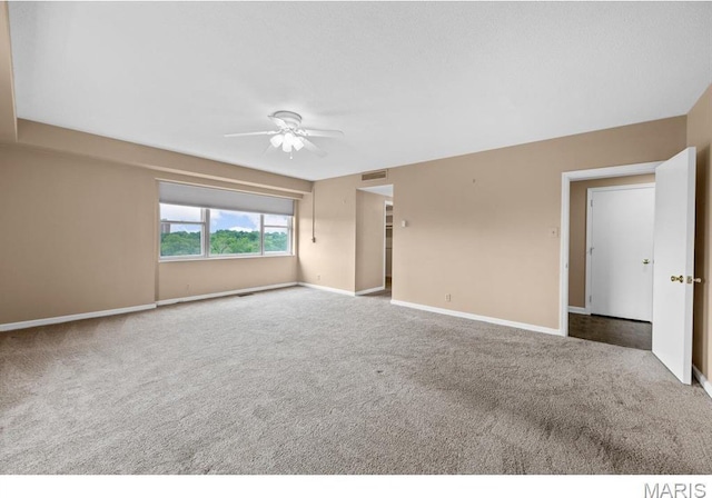 710 S Hanley Rd Unit 10A, Clayton, MO 63105 - empty room featuring carpet flooring and ceiling fan