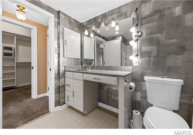 710 S Hanley Rd Unit 10A, Clayton, MO 63105 - bathroom with vanity and tile patterned floors