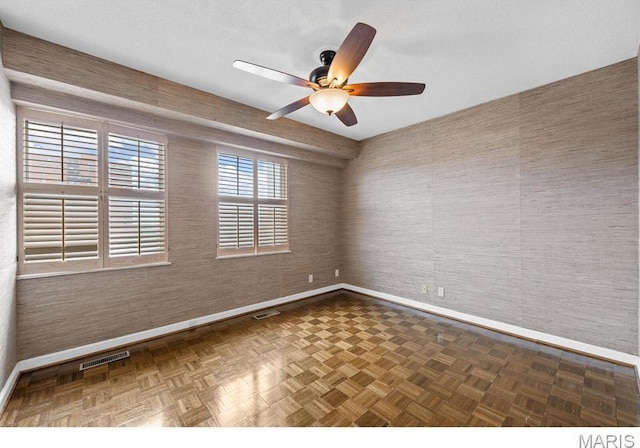 710 S Hanley Rd Unit 10A, Clayton, MO 63105 - unfurnished room with baseboards and a ceiling fan