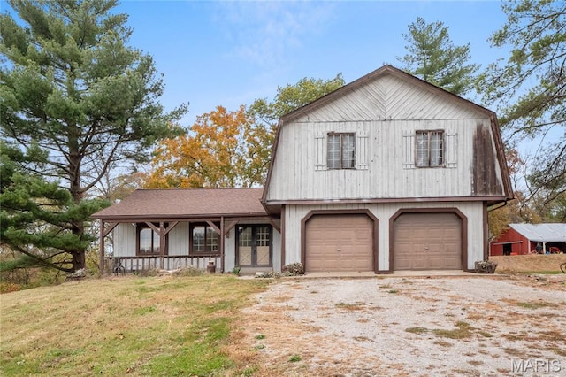 2745 Zingg Rd, Millstadt, IL 62260 - colonial inspired home with a gambrel roof, a porch, driveway, and a front yard