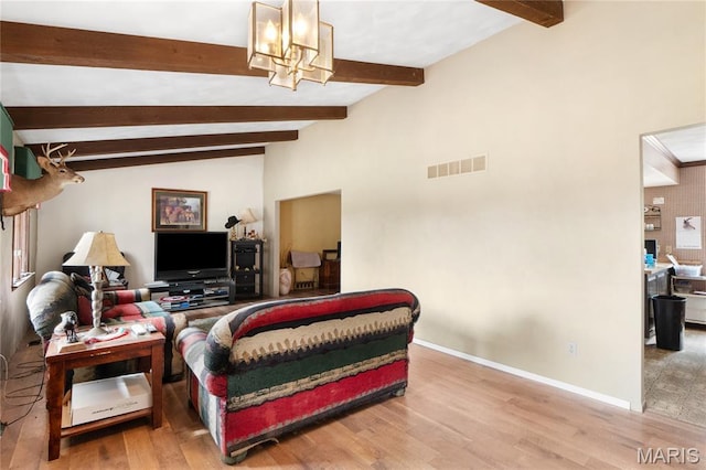 2745 Zingg Rd, Millstadt, IL 62260 - living room featuring a chandelier, wood finished floors, and baseboards