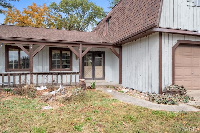 2745 Zingg Rd, Millstadt, IL 62260 - property entrance featuring a shingled roof, a garage, and a porch