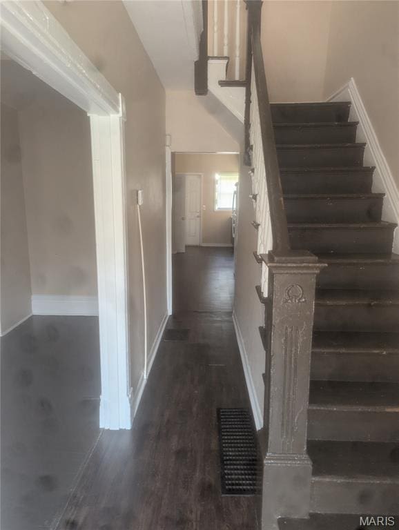 4737 Beacon Ave, Saint Louis, MO 63120 - stairway with baseboards and wood finished floors