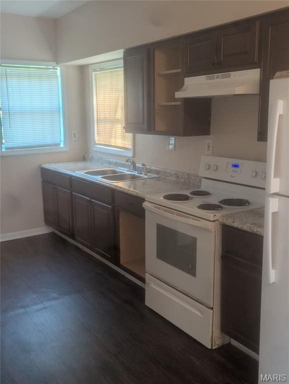 4737 Beacon Ave, Saint Louis, MO 63120 - kitchen featuring white appliances, under cabinet range hood, light countertops, dark brown cabinets, and dark wood-style floors