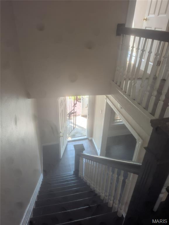 4737 Beacon Ave, Saint Louis, MO 63120 - stairs with baseboards