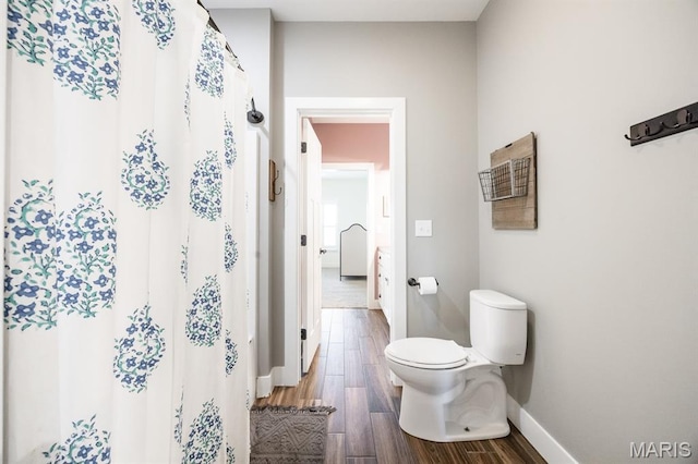 1821 Orr Ln, Ofallon, IL 62269 - full bath with toilet, baseboards, wood finished floors, and curtained shower