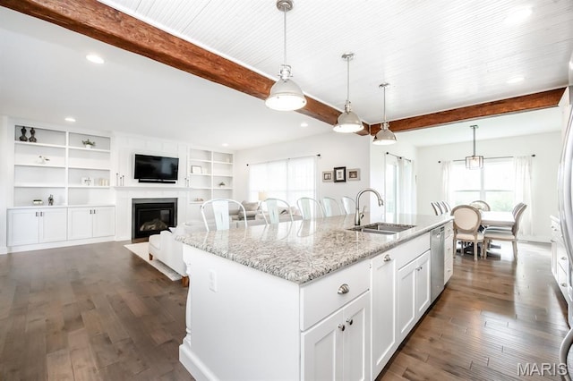 1821 Orr Ln, Ofallon, IL 62269 - kitchen with a sink, beamed ceiling, plenty of natural light, a kitchen island with sink, and dark wood-style flooring