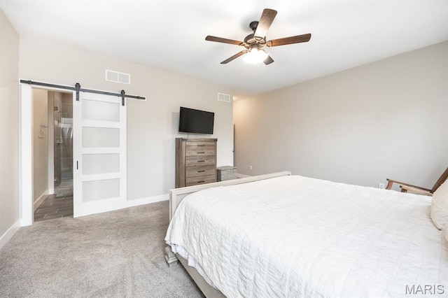 1821 Orr Ln, Ofallon, IL 62269 - carpeted bedroom with a barn door, baseboards, and a ceiling fan