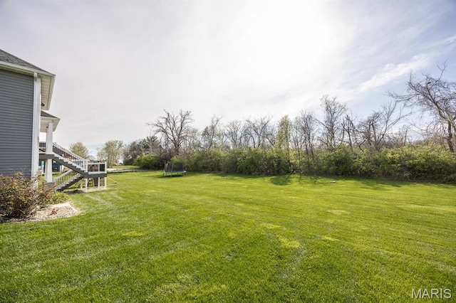 1821 Orr Ln, Ofallon, IL 62269 - view of grassy yard featuring stairs and a trampoline