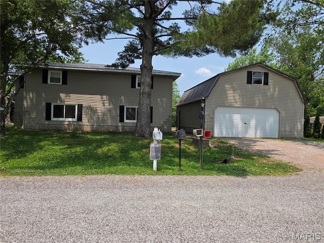 18835 Mary Jane Ln, Carlyle, IL 62231 - view of front facade featuring an outbuilding, a front yard, driveway, a detached garage, and a gambrel roof
