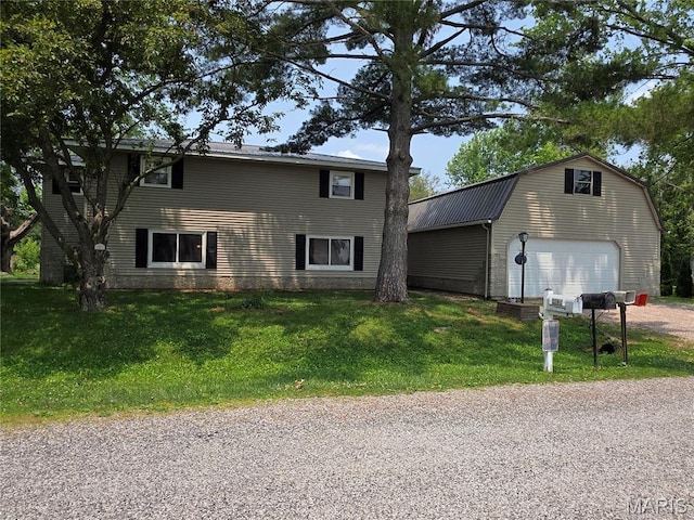 18835 Mary Jane Ln, Carlyle, IL 62231 - view of front of house with an outdoor structure, a gambrel roof, a detached garage, a front lawn, and driveway
