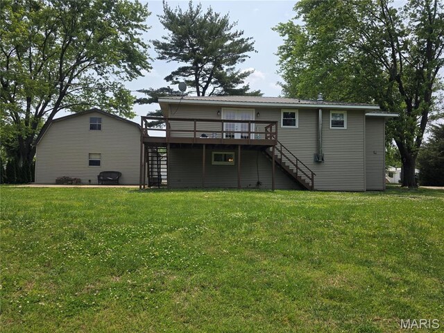 18835 Mary Jane Ln, Carlyle, IL 62231 - back of property featuring stairs, a wooden deck, and a lawn