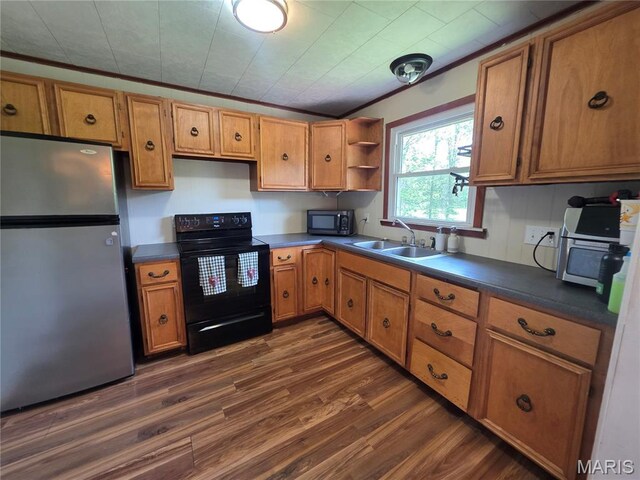 18835 Mary Jane Ln, Carlyle, IL 62231 - kitchen featuring appliances with stainless steel finishes, a sink, dark wood-type flooring, and brown cabinetry