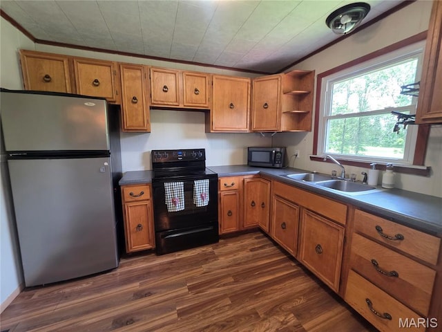 18835 Mary Jane Ln, Carlyle, IL 62231 - kitchen featuring appliances with stainless steel finishes, a sink, brown cabinetry, dark wood-type flooring, and ornamental molding