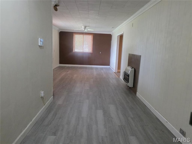 18835 Mary Jane Ln, Carlyle, IL 62231 - hallway featuring heating unit, ornamental molding, wood finished floors, and baseboards