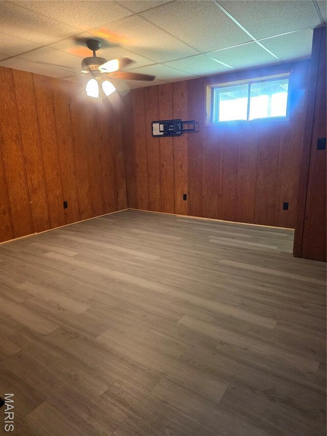 18835 Mary Jane Ln, Carlyle, IL 62231 - basement with wood finished floors, a ceiling fan, and wooden walls