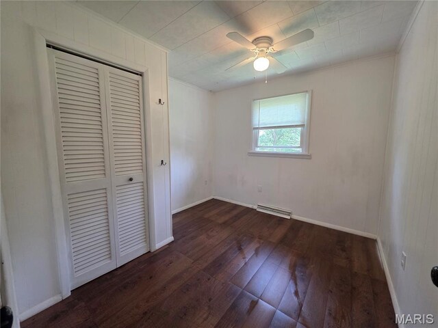 18835 Mary Jane Ln, Carlyle, IL 62231 - unfurnished bedroom with wood-type flooring, a closet, crown molding, baseboards, and a ceiling fan